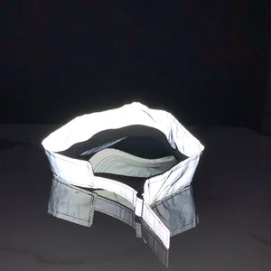 Macro shot of silver reflective sun visor cap with adjustable strap for night safety