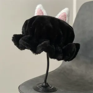 Close-up of plush cat ear winter hat with soft faux fur texture and ruffled edge details