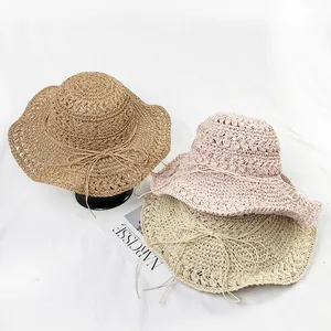 Handmade crochet straw hats for women with elegant wavy brims and bow tie details