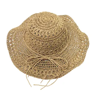 Handcrafted crochet straw sun hat for women with bow tie detail and hollow weave