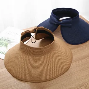 Foldable wide brim straw sun hat for women with bow detail in khaki and navy blue
