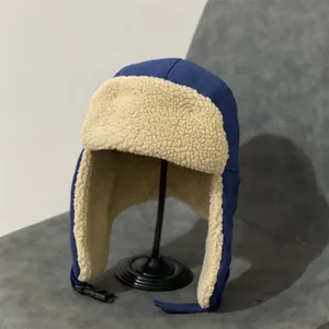 Winter bomber hat with thick fleece lining and ear flaps for windproof warmth