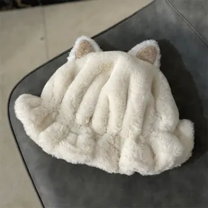 Detailed macro shot of plush cream faux fur texture and cute cat ear design on a cozy hat