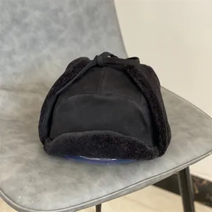 Close-up of black faux suede trapper hat with thick plush fur lining for winter warmth