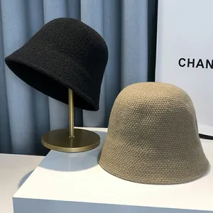 Knitted bucket hat for women in black and khaki colors with thick ribbed texture