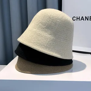 Minimalist knitted bucket hat for women in beige black and khaki with textured weave
