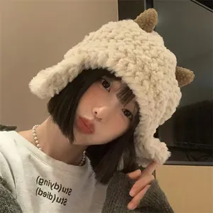 Detail of plush lamb wool hat with brown horns and ear protection on a model