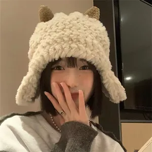 Warm off-white plush trapper hat with cute brown lamb horns and ear flaps for women