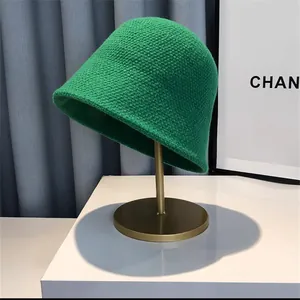 Women's bright green knitted bucket hat with a stylish round top and rolled brim