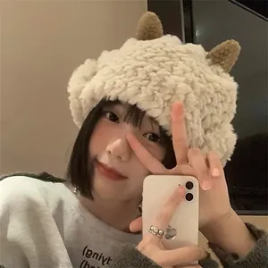Detail of plush lamb earflap hat with cute brown horns and soft winter texture