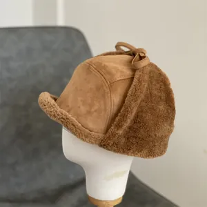 Thick suede trapper hat with warm faux lamb wool lining and cozy ear flaps for winter
