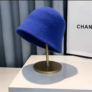 Detail shot of Klein blue knitted bucket hat showing chunky knit texture and bell shape