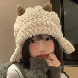 Close-up of soft beige plush earflap hat with cute brown horns and warm fleece lining
