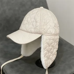 Winter heart-quilted trapper hat with warm ear flaps and faux fur lining in cream white