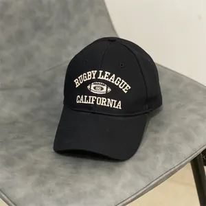 Close-up of vintage California Rugby League embroidery on a black cotton baseball cap