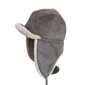 Thick grey faux suede trapper hat with warm sherpa lining and ear flaps for winter