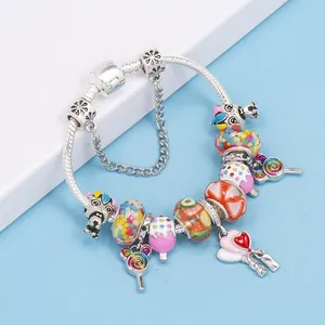 DIY charm bracelet with rainbow lollipop pendants and colorful fruit glass beads on a snake chain