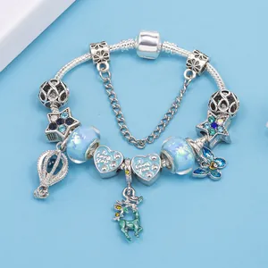 DIY Christmas charm bracelet with blue reindeer heart and star pendants on snake chain