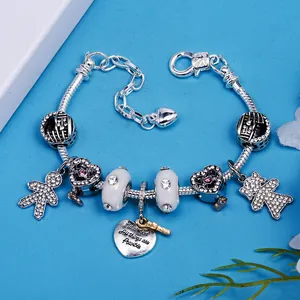Romantic silver beaded charm bracelet with heart pendants and motivational tag engraving