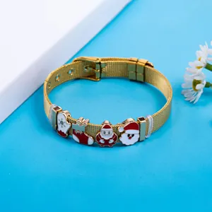 Detail of golden stainless steel mesh bracelet with festive Santa enamel charms