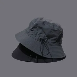 Foldable quick-dry bucket hat with adjustable drawstring for outdoor streetwear style