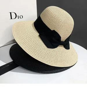 Chapeau de paille femme à large bord avec ruban noir pour plage et protection UV
