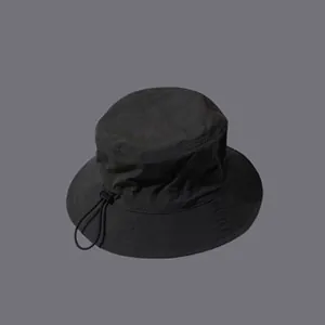 Detail of waterproof bucket hat showing adjustable elastic drawstring and plastic toggle