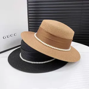 Elegant wide brim straw boater hats in khaki and black with ribbon and pearl chain trim
