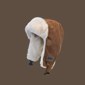 Brown winter trapper hat with warm white faux fur lining and ear flaps for cold weather