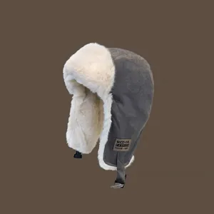 Winter unisex gray trapper hat with white faux fur lining and ear flaps for cold weather