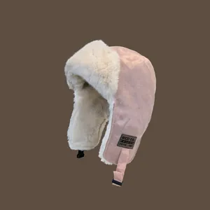 Pink winter trapper hat with warm faux fur lining and ear flaps for extreme cold weather