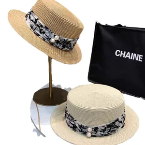 Damen Strohhut mit breiter Krempe, floralem Chiffonband und eleganter Perlenschnalle