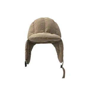 Winter khaki quilted bomber hat with windproof fabric and earflaps for outdoor warmth