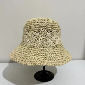 Women's breathable crochet straw bucket hat with hollow flower pattern for summer