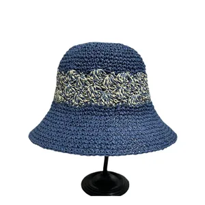 Breathable navy straw cloche hat with cream crochet band and wide brim for sun protection