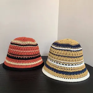 Close-up of hand-woven crochet bucket hats showing striped knit pattern and texture