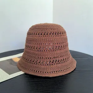Brown crochet knit hollow bucket hat for women with minimalist retro vintage style