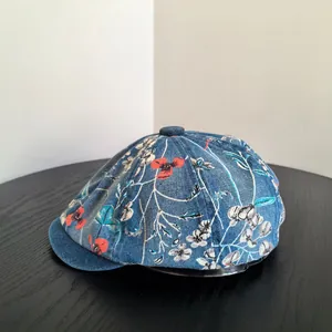 Retro denim newsboy hat with floral print and decorative top button for women