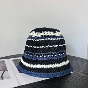 Japanese style hand-knitted striped bucket hat in black and white for women's sun protection