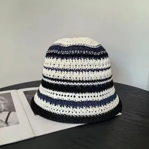Close-up of the knitted texture and horizontal stripes on the summer bucket hat