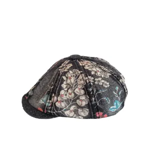 Retro washed denim newsboy cap with floral print and a stylish vintage octagonal design