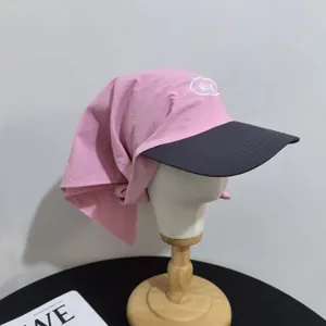 Pink sun hat with wide brim and neck protection flap featuring Nice embroidery detail