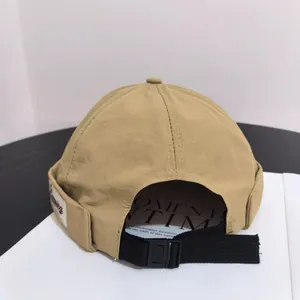 Detailed back view of khaki miki hat showing nylon fabric and adjustable buckle strap