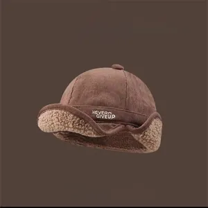 Winter brown corduroy earflap hat with warm lamb wool lining and Never Give Up embroidery