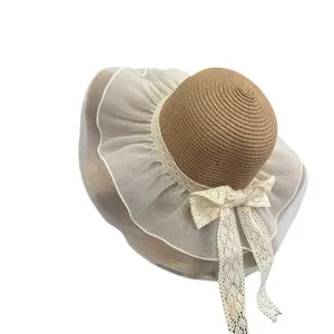 Elegant wide brim straw hat with white organza trim and lace ribbon bow for sun protection