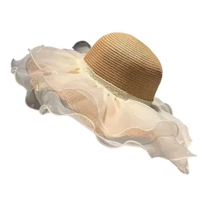 Women's summer straw sun hat with wide wavy lace brim and elegant ribbon for beach vacation