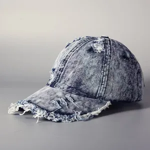 Unisex vintage washed denim baseball cap with distressed frayed edges and dark blue finish