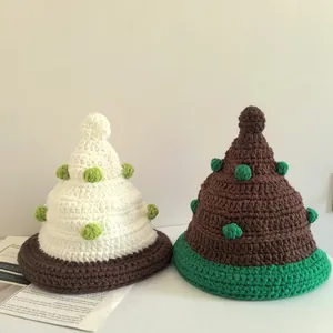 Detailed stitch texture of handmade crochet Christmas tree hats with decorative mini balls
