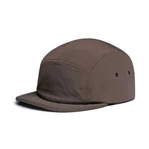 Detail view of the breathable metal eyelets and ripstop texture on a 5-panel hat