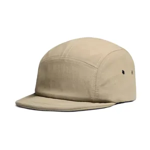 Detail of khaki 5-panel camping hat featuring contrast stitching and metal side eyelets